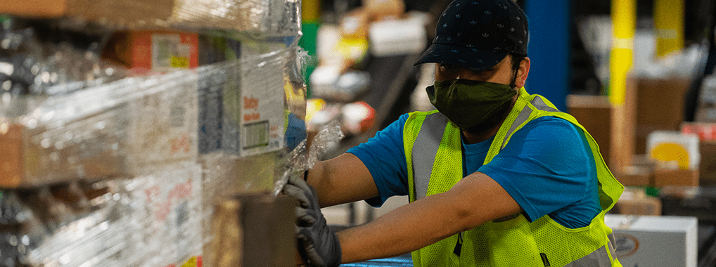 KeHE warehouse employee moving a pallet