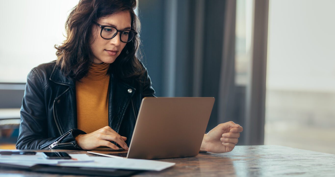 Woman using her laptop to access KeHE shows