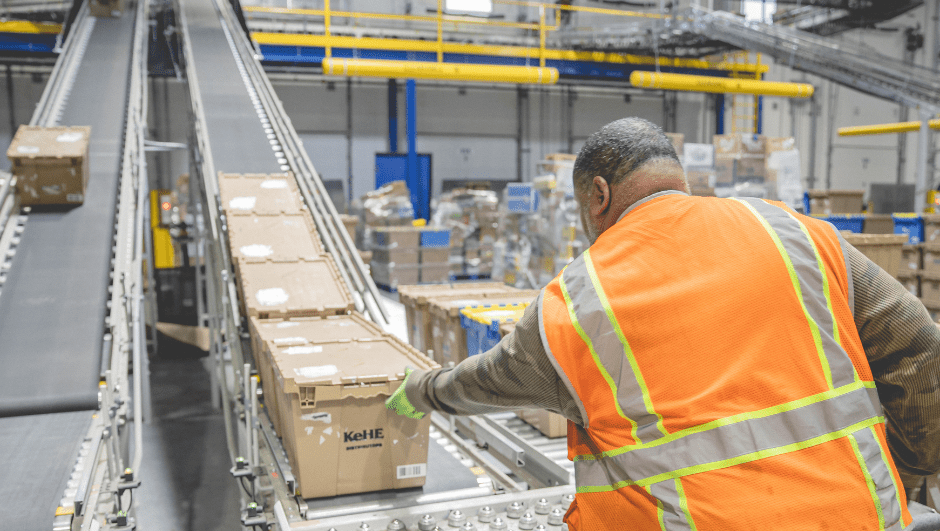 KeHE Employee Sorting Boxes in Warehouse