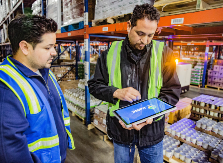 Warehouse workers using iPad