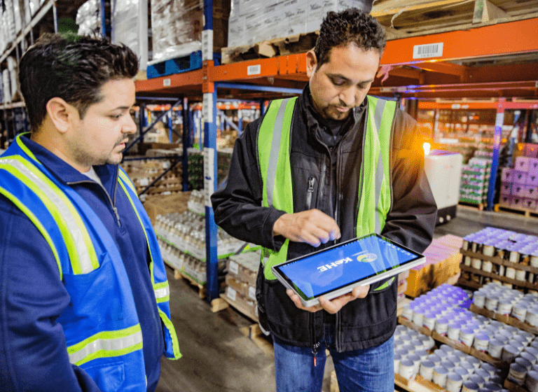 Warehouse workers using iPad