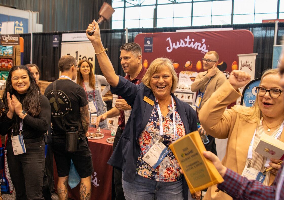 group celebrating on tradeshow floor