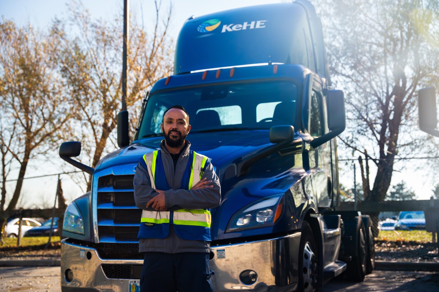 Truck Driver Standing in Front of Truck