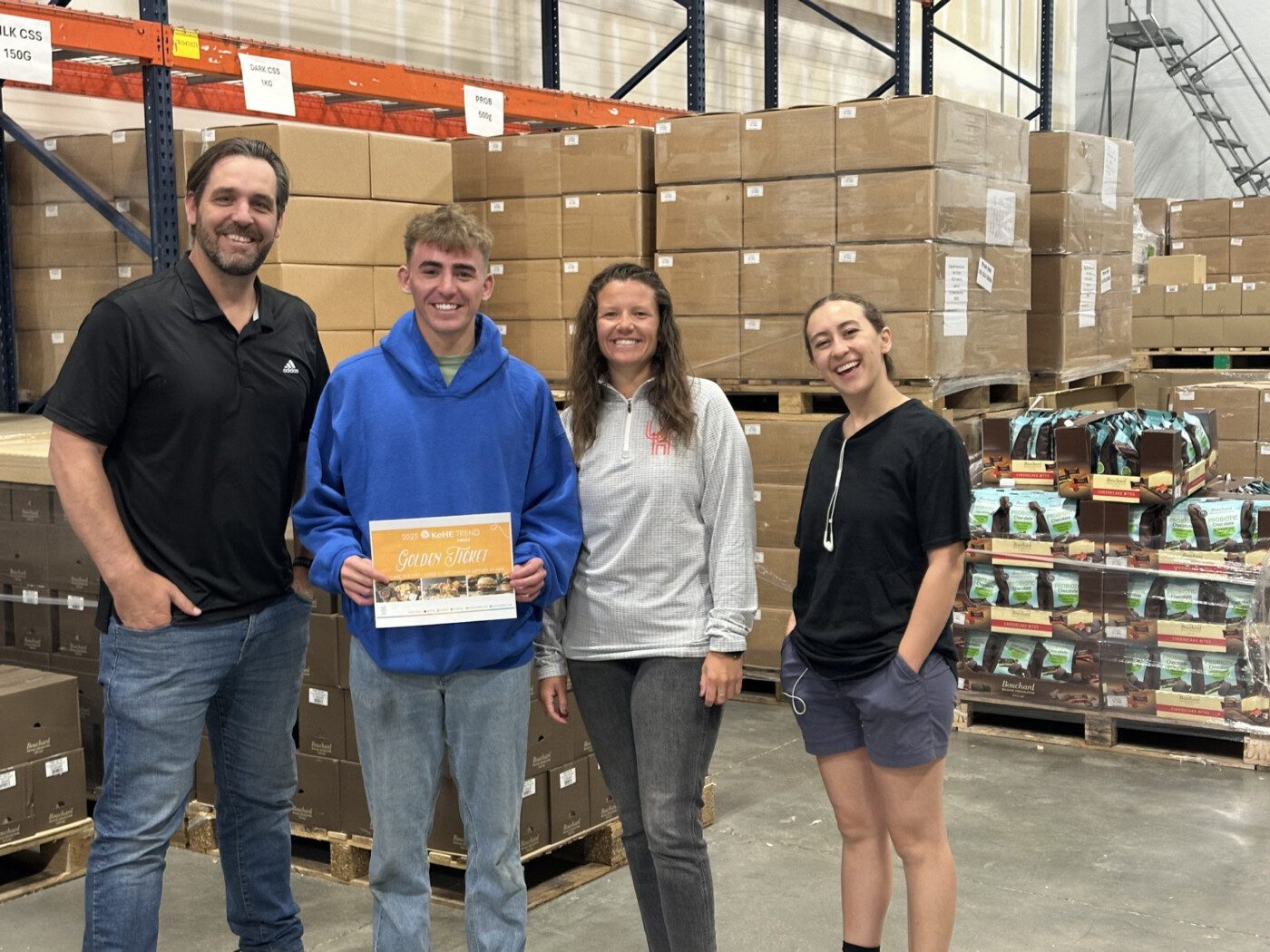 Group in warehouse receiving award